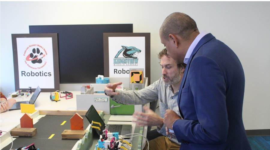 Todd Leff, A Robotics Teacher At Kingsview Middle School, Shows Eduardo Naboa, Cybersecurity Lab Manager For Montgomery College (standing), How Lego Robotics Works During A Cyber Fair At Montgomery College On Saturday, Nov. 12.